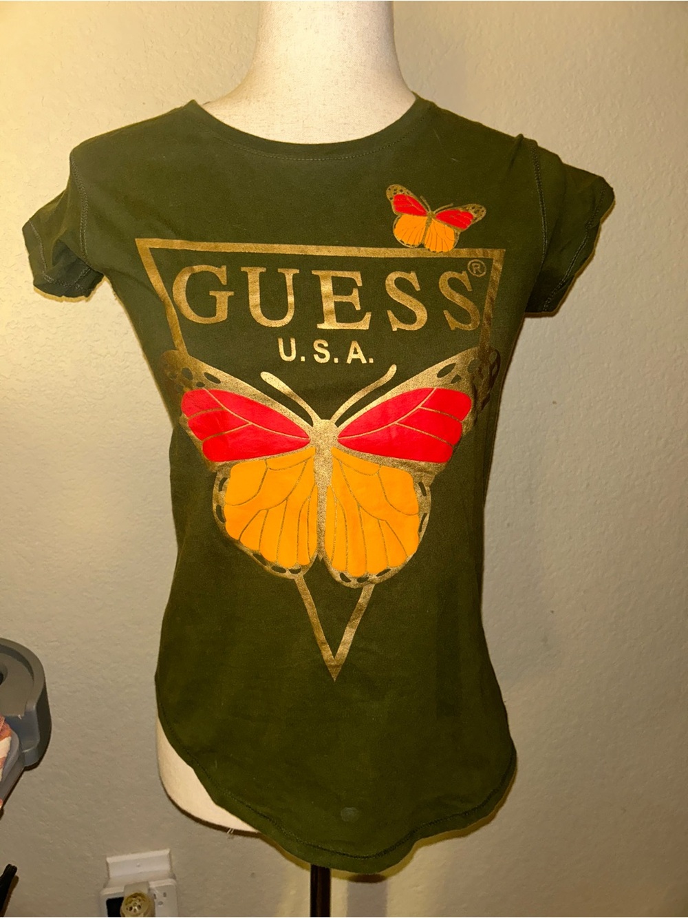 Guess Olive Butterfly Graphic Tee with Gold Logo and Red & Orange Accent